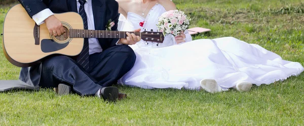 Bride and groom with the guitar Stock Photo