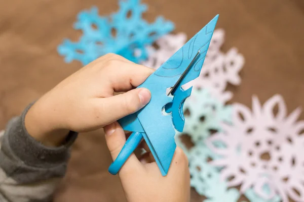 Child Cuts Snowflake Out Paper — Stock Photo, Image