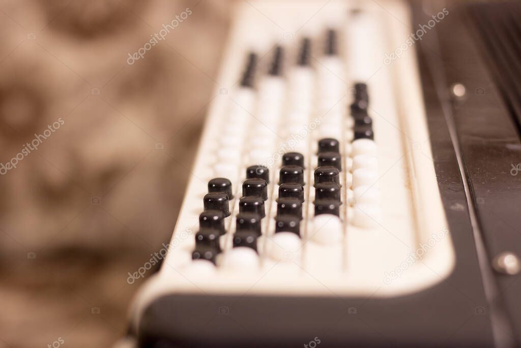 Keys of an old accordion close-up
