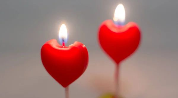 Two Candles Form Heart Burning — стоковое фото