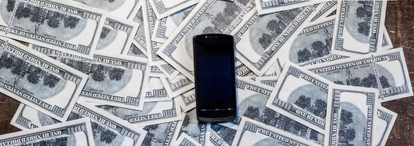 Mobile phone on banknotes. The rise in price of mobile communications due to the war between Ukraine and Russia