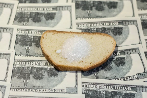Bread with sugar on banknotes. Increasing the cost of food due to the war in Ukraine