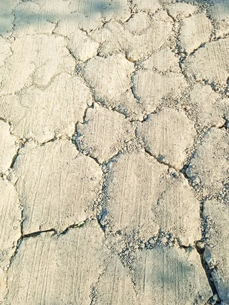 Dried soil on city streets close-up