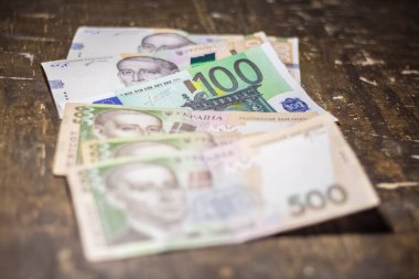 100 euro bill among 500 hryvnia bills. Inflation in Ukraine due to the war