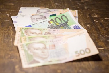 100 euro bill among 500 hryvnia bills. Inflation in Ukraine due to the war