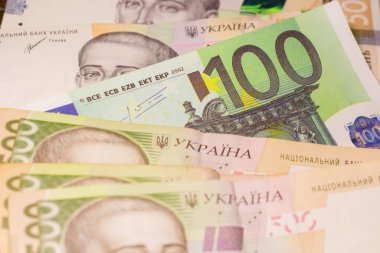 100 euro bill among 500 hryvnia bills. Inflation in Ukraine due to the war