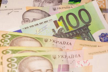 100 euro bill among 500 hryvnia bills. Inflation in Ukraine due to the war