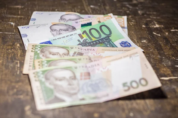 100 euro bill among 500 hryvnia bills. Inflation in Ukraine due to the war