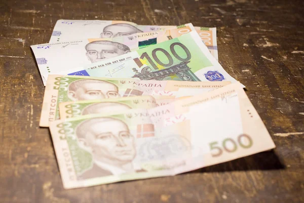 100 euro bill among 500 hryvnia bills. Inflation in Ukraine due to the war