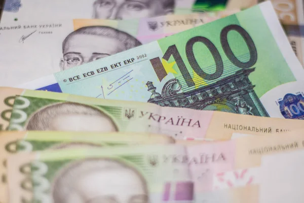100 euro bill among 500 hryvnia bills. Inflation in Ukraine due to the war