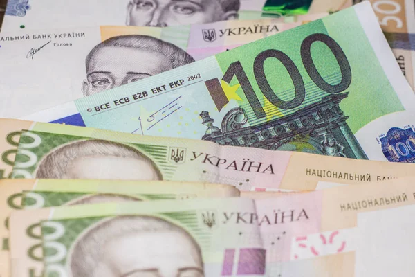 100 euro bill among 500 hryvnia bills. Inflation in Ukraine due to the war