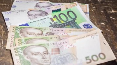 100 euro bill among 500 hryvnia bills. Inflation in Ukraine due to the war