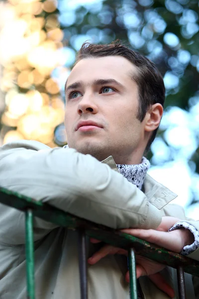 Young male model looks on his left with green eyes — Stock Photo, Image