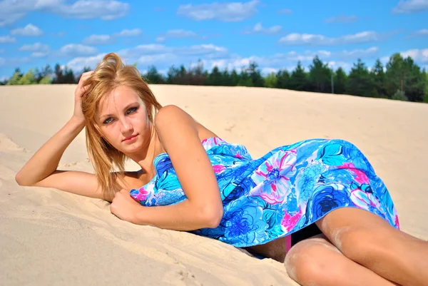 Young sexual model is on the sand covered only with a tissue — Stock Photo, Image