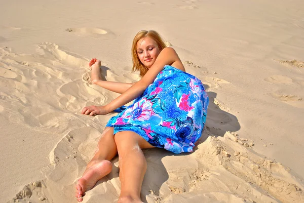 Sexual naked blond model covered with a blue tissue poses — Stock Photo, Image