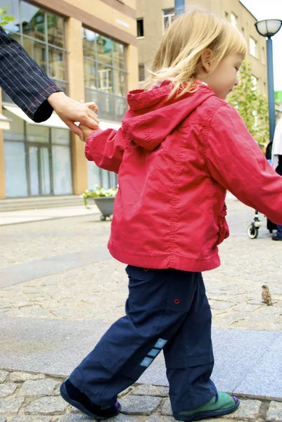 Little girl carries her mother by hands — Stock Photo, Image