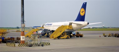 Plane of the Lufthansa company in the International Vienna Airport clipart