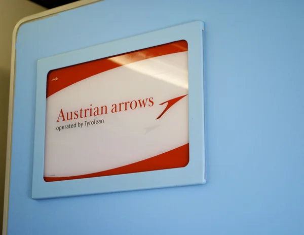 Austrian Airlines sign in the plane — Stock Photo, Image