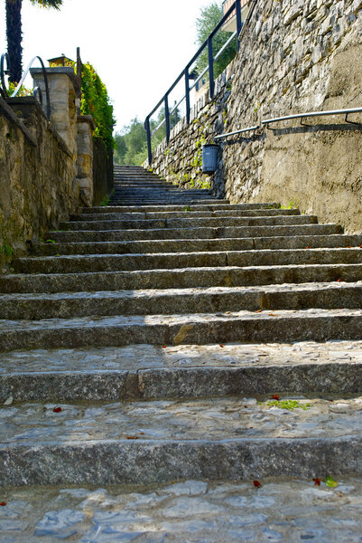 Stone stair way in the town on the mountain hill called Gandria, Switzerland