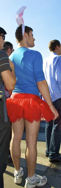 Boy wears red skirt and bunny ears — Stock Photo, Image