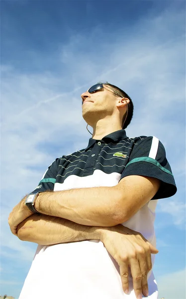 Man in polo poses — Stock Photo, Image