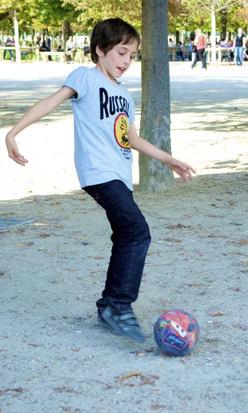 Little boy plays football — Stock Photo, Image