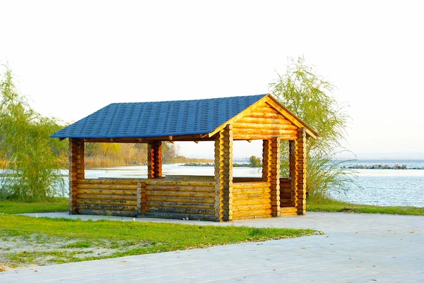 Small wooden house with blue roof — Stock Fotó