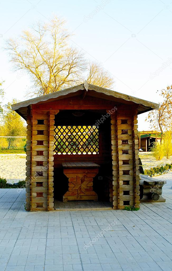 Small wooden house with a table