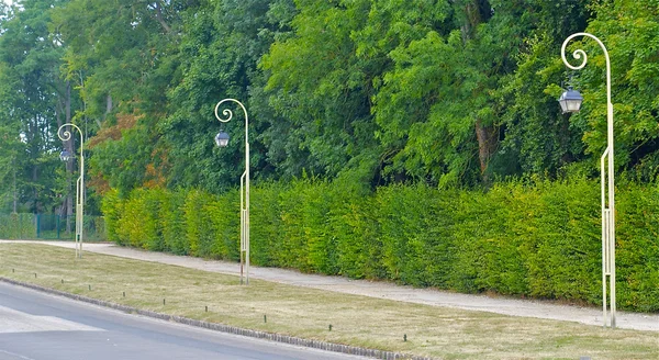 Linie von drei Laternenmasten — Stockfoto