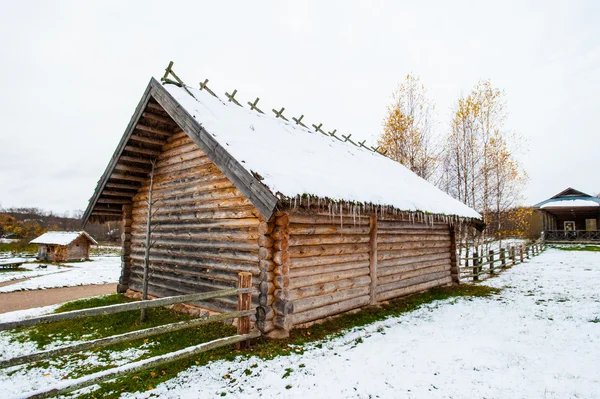 Wooden house in winter in Russia — Stok fotoğraf