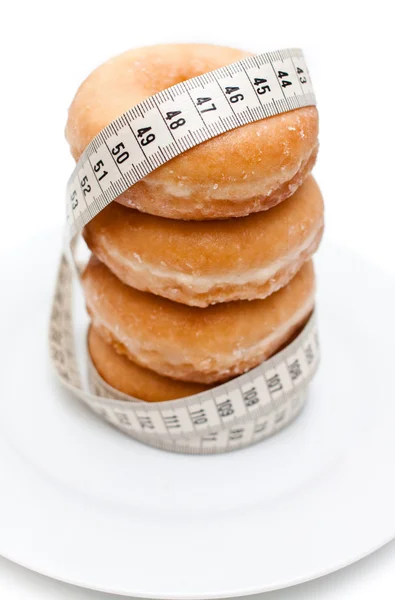 Donuts con una cinta métrica — Fotografia de Stock