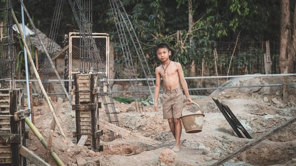 Poor children are forced to work construction, Violence children and trafficking concept,Anti-child labor, Rights Day on December 10.