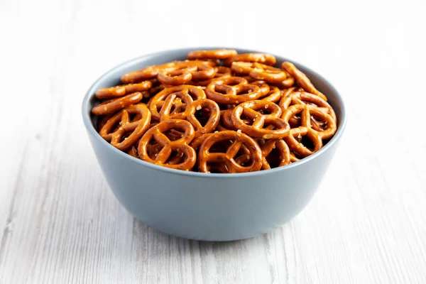 Crispy Salty Baked Pretzels Bowl White Wooden Background Side View — Stock Photo, Image