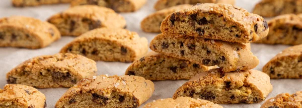 Homemade Italian Cantuccini with Chocolate, side view. Crispy Chocolate Cookies.