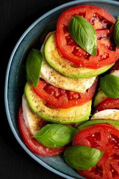 Homemade Organic Avocado Caprese Salad Plate Black Background Top View — Stok fotoğraf