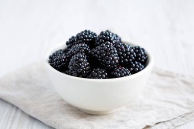 Raw Blackberries in a Bowl, side view. 
