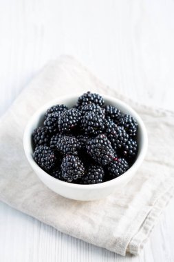 Raw Blackberries in a Bowl, side view. 