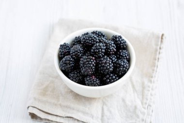 Raw Blackberries in a Bowl, side view.