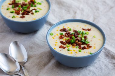 Homemade Corn Chowder with Bacon in Bowls, side view.
