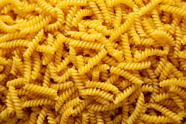 Uncooked Dry Girandole Torsades Pasta Background — Photo