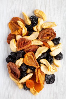 Organic healthy fruit mix on a white wooden background, top view. Flat lay, overhead, from above. 