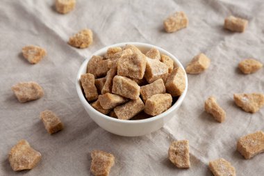 Raw Organic Demerara Granulated Brown Sugar in a Bowl, side view.