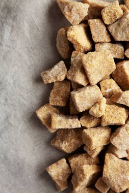 Raw Organic Demerara Granulated Brown Sugar, top view. Copy space.