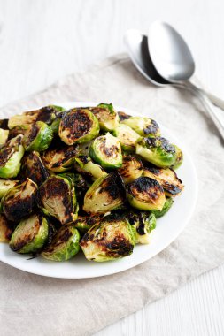 Homemade Roasted Brussel Sprouts on a Plate, low angle view. Close-up.