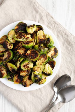 Homemade Roasted Brussel Sprouts on a Plate, top view. Flat lay, overhead, from above.