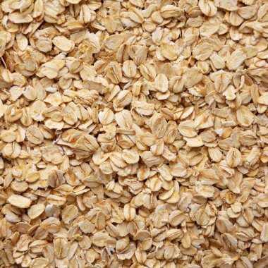 Dry Organic Rolled Oats Background