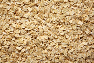Dry Organic Rolled Oats Background