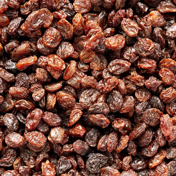 Dried Brown Raisins, top view. Flat lay, overhead, from above. Close-up.