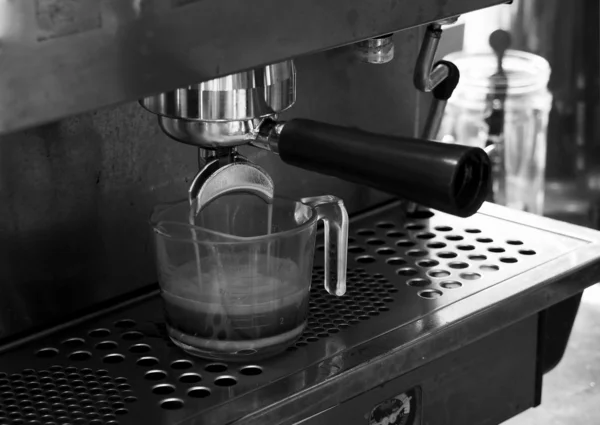 Coffee flow from Portafilter on espresso machine — Stock Photo, Image
