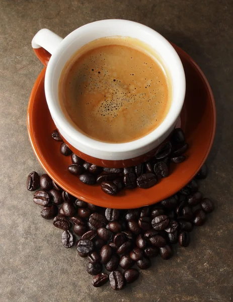 Cup of coffee and coffee beans — Stock Photo, Image